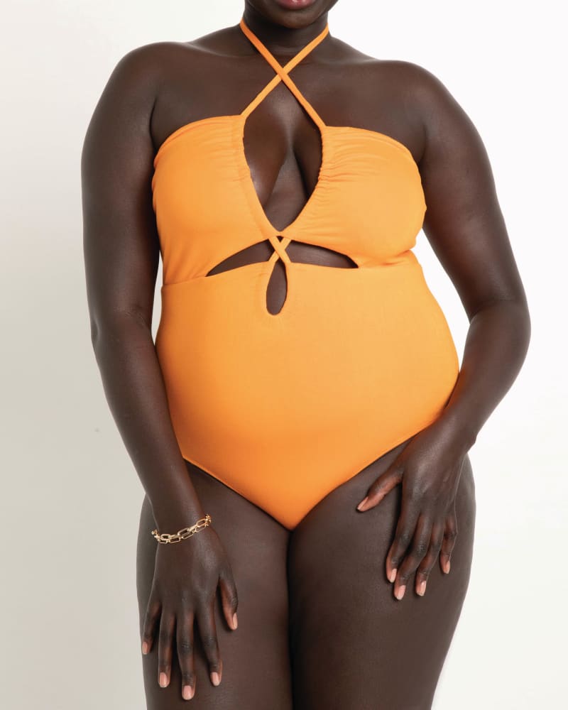 Front of a model wearing a size 14|16 Emely Cutout Bodysuit With Halter in Russet Orange by ELOQUII. | dia_product_style_image_id:195663